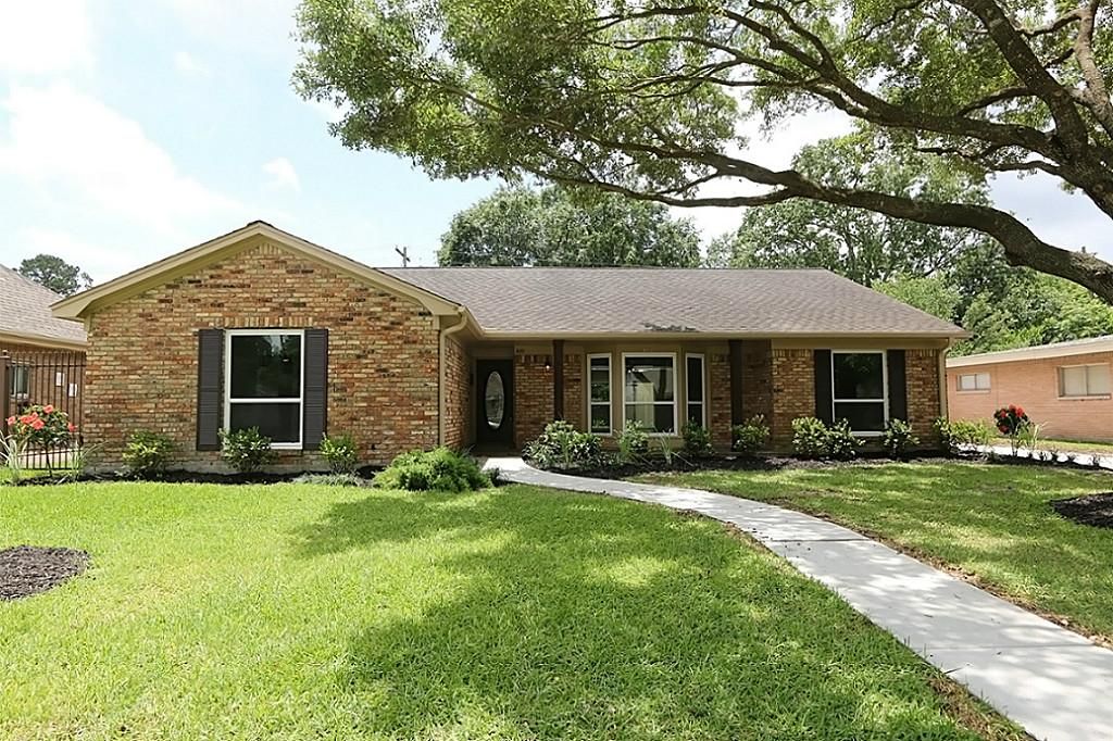 Renovated brick home with steel glass accordion doors