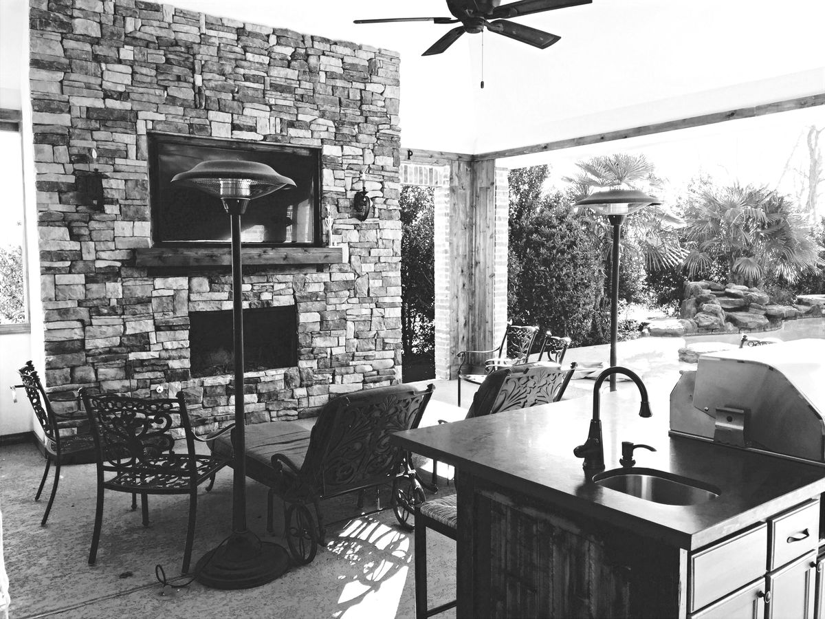 Pool and gazebo area with lush landscaping